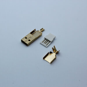 Gold USB-A parts close up on white background