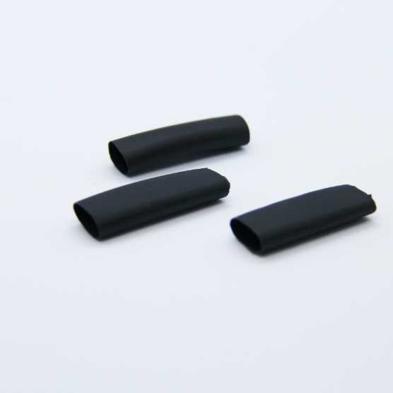 3 pieces of black heat-shrink on a white background