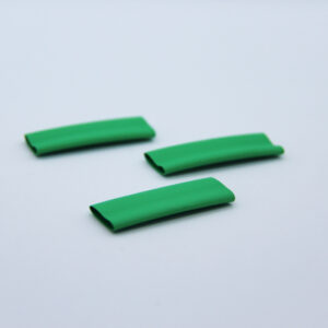 3 pieces of green heat-shrink on a white background