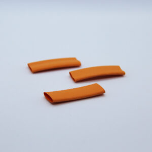3 pieces of orange heat-shrink on a white background