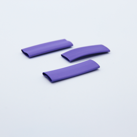 3 pieces of purple heat-shrink on a white background