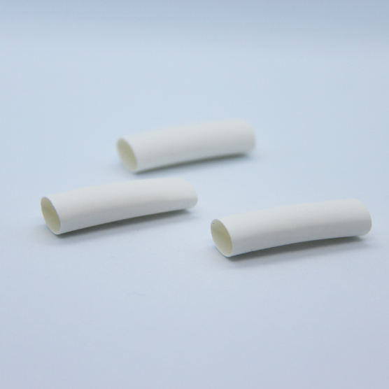 3 pieces of white heat-shrink on a white background