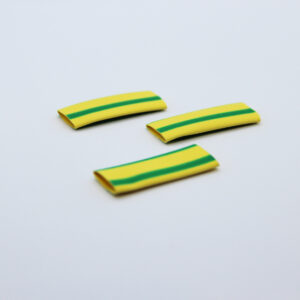 3 pieces of yellow and green heat-shrink on a white background