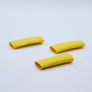 3 pieces of yellow heat-shrink on a white background