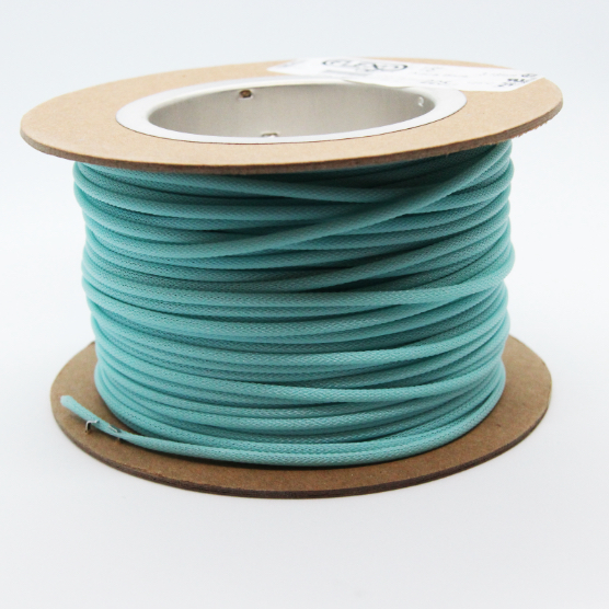 A spool of techflex on a white background