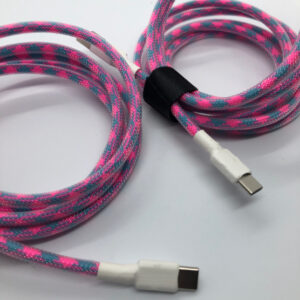 Close up of 2 straight pink and blue USB-C cables on a white background