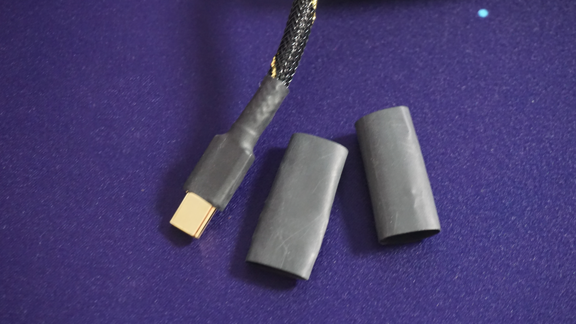 close up of black heatshrink on a USB cable